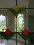 closeup of French Doors with stained glass
